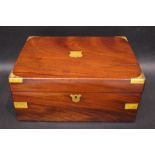 A BRASS BOUND MAHOGANY WRITING BOX, with brass cartouche and key plate, a velvet covered writing