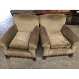 A PAIR OF MATCHING ARMCHAIRS, 1930s, oak, raised on bun feet, 32" (w) x 30" (h)