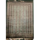 A VERY FINE PAKISTAN 20TH CENTURY WOOL & SILK FLOOR RUG, with green over all ground colour;