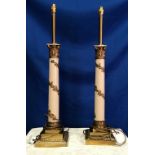 A PAIR OF BRASS & METAL PAINTED TABLE LAMPS, CORINTHIAN FORM, with foliage detail wrapped around the