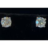 A PAIR OF 18CT WHITE GOLD CLAW SET DIAMOND STUD EARRINGS, superior quality, 1.06cts