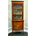 A FINE EDWARDIAN BOW FRONTED DISPLAY CABINET, the top section is flat with an astragal glazed door