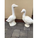 A PAIR OF STONE GARDEN ORNAMENTS IN THE FORM OF TWO GEESE