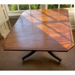 A REGENCY MAHOGANY CROSSBANDED DROP LEAF TABLE, with a drawer, raised on four down swept reeded