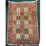 A VERY FINE BAKHTIARI FLOOR RUG, mid 20th century or earlier, with triple floral border, and a