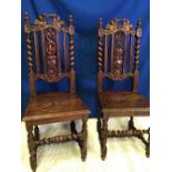 A PAIR OF VERY FINE OAK CARVED HALL CHAIRS, each with carved and pierced back supports, with a