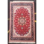 A FINE PERSIAN ‘TABRIZ’ FLOOR RUG, part silk, hand knotted from the village of Kandovan, with