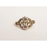 AN EDWARDIAN STYLE TWO DIAMOND RING, with leaf shaped mount having paved diamonds to it, main