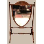 A VERY FINE MAHOGANY FIRE SCREEN, with shield shaped mirrored centre panel, having very fine