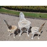 A TOP QUALITY HEAVY CAST IRON VICTORIAN STYLE GARDEN SET, with circular table raised on four legs