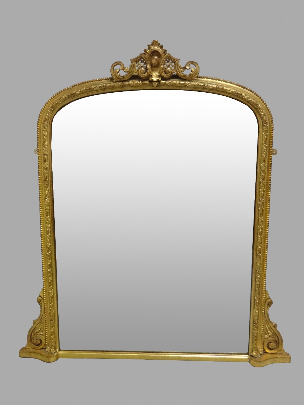 A VERY GOOD QUALITY 19TH CENTURY GILT OVER MANTLE MIRROR, fully restored, having an arched top