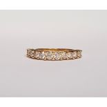 AN 18CT YELLOW GOLD 11 STONE ETERNITY RING