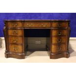 A GOOD QUALITY 19TH CENTURY LEATHER TOPPED PEDESTAL DESK, with 3 serpentine shaped graduated drawers