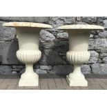 A PAIR OF WHITE CAST IRON GARDEN URNS, 29” x 22” approx