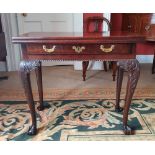 A VERY FINE IRISH MAHOGANY FOLD OVER TEA TABLE, a single frieze drawer with brass handles and key