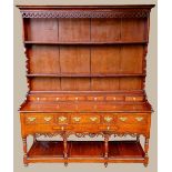 A VERY FINE GEORGIAN SOLID OAK WELSH DRESSER, with a panelled back gallery having two open