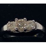 AN 18CT WHITE GOLD DIAMOND THREE STONE RING, round brilliant cut claw set diamond ring , diamond