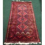 A PERSIAN BALOUCH RUNNER, with multiple border and central four medallions of geometric design,