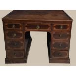 A REGENCY INLAID MAHOGANY DESK, with crossbanded top, and 3 drawers over 6 drawers, each with