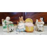 A BESWICK BEATRIX POTTER FIGURINE OF 'HUNCA MUNCA" WITH STRAW CRIB, possible BP-2, marks beneath,