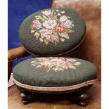 A PAIR OF LOW RISE FOOT STOOLS, with floral needlepoint embroidered tops, raised on turned legs,