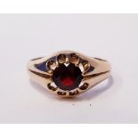 A 9CT GOLD RING WITH RUBY STONE, marked 375 and maker's mark, with lion head, cased
