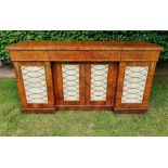 A GOOD QUALITY 19TH CENTURY FLAME MAHOGANY 4 DOOR CABINET, break front having central frieze drawer,