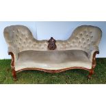 A GOOD QUALITY 19TH CENTURY MAHOGANY FRAMED double hump button backed settee, with central carved