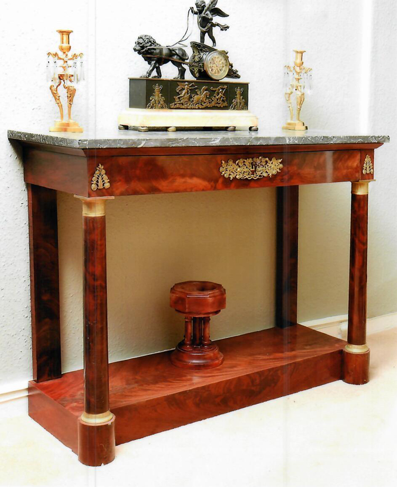 A FRENCH EMPIRE FLAME MAHOGANY ORMOLU MOUNTED MARBLE TOPPED CONSOLE TABLE, with oak lined drawer,