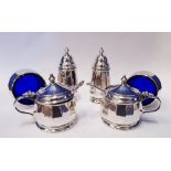 A SET OF SILVER CONDIMENT CONTAINERS, includes; Salt & pepper shakers, two salts with blue glass