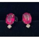 A PAIR OF PLATINUM RUBY & DIAMOND EARRINGS