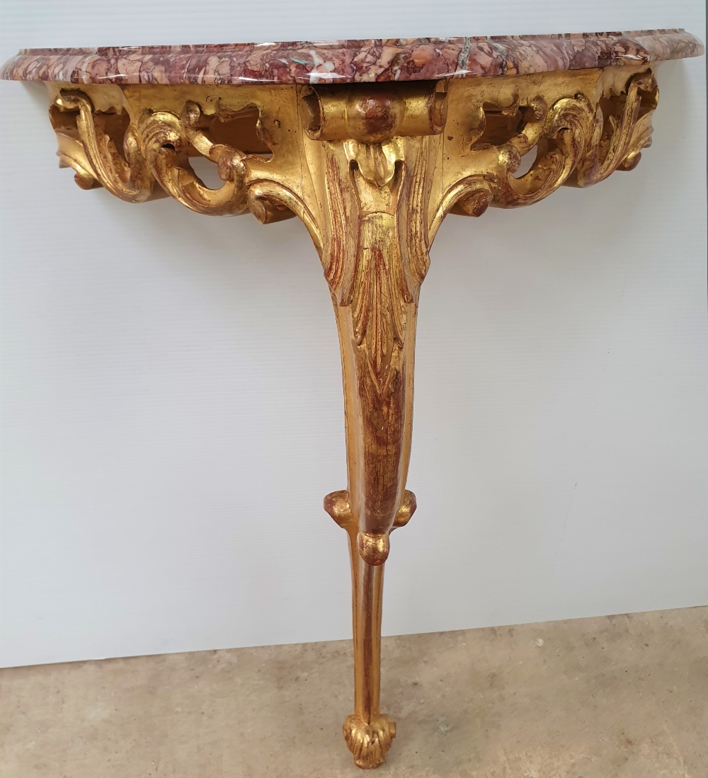 A NEATLY SIZED 19TH CENTURY MARBLE TOPPED GILT CONSOLE TABLE, single leg, with carved foliage