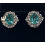 A PAIR OF 18CT COLOMBIAN EMERALD & DIAMOND CLUSTER EARRINGS, Emeralds surrounded by round