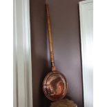 A VICTORIAN COPPER WARMING PAN, engraved, excellent condition, 44” high x 11.75” round approx