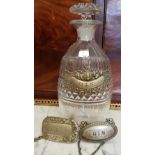 A 19TH CENTURY GLASS DECANTER WITH TOPPER, and 3 silver plated decanter tags