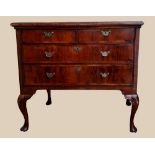 AN 18TH CENTURY IRISH WALNUT AND CROSS-BANDED CHEST, 2 over 2 drawers, raised on cabriole legs,
