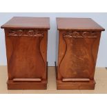 A GOOD QUALITY PAIR OF 19TH CENTURY FLAME MAHOGANY BEDSIDE CABINETS, each with a raised shield