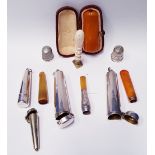 A COLLECTION OF ITEMS, includes; A collection of amber Cheroots and holders, various maker"s marks