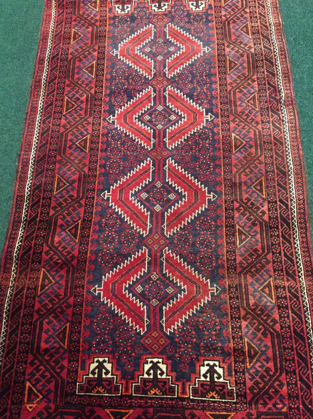 A PERSIAN BALOUCH RUNNER, with multiple border and central four medallions of geometric design, - Image 2 of 2