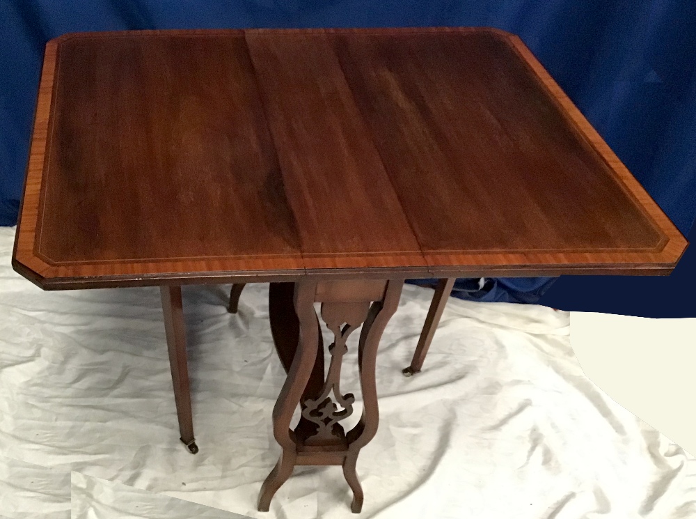 A FINE MAHOGANY DROP-LEAF SUTERLAND TABLE with canted corners to the top, and satinwood cross-