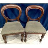 A PAIR OF BALLOON BACKED VICTORIAN CHAIRS, each raised on turned tapered leg