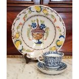 A CERAMIC PLATE & A CUP AND SAUCER, both possibly Dutch, 18th / 19th century, (i) Deep plate / bowl,