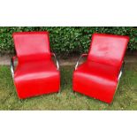 AN UNUSUAL PAIR OF BRIGHT RED LEATHER ARMCHAIRS, circa 1970s with curved chrome frame/arm rest/ leg,