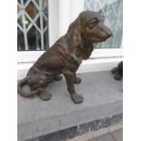 A SMALL HEAVY BRONZED DOG, 14in high