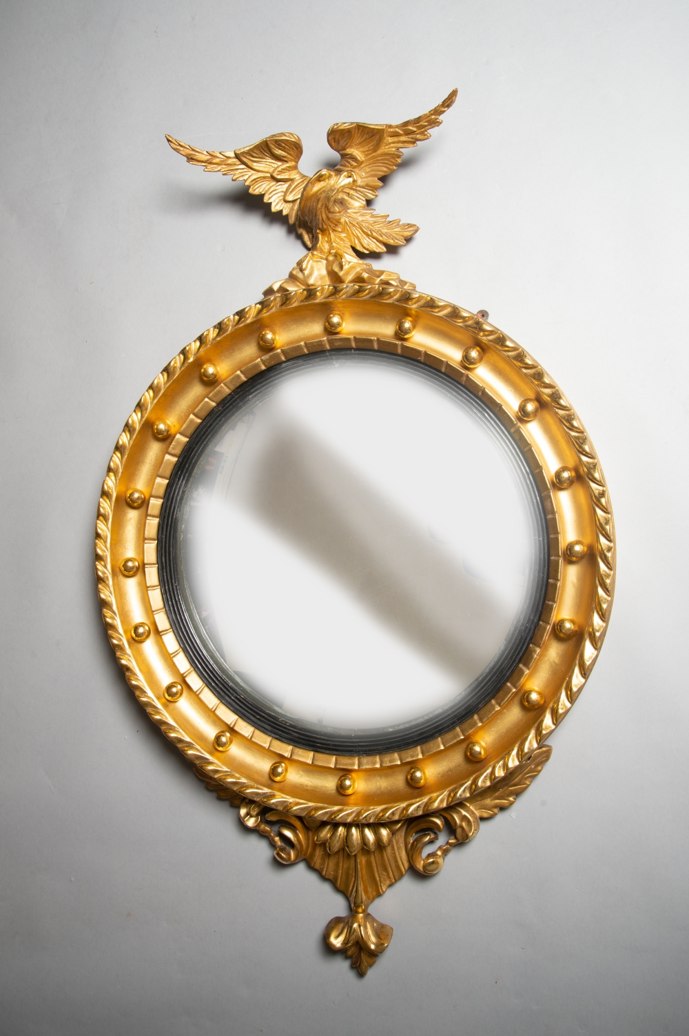 A VERY FINE WILLIAM IV CARVED GILTWOOD CONVEX MIRROR, with carved eagle perched on a cluster of - Image 2 of 2