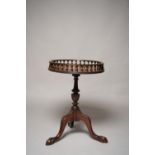 A 20TH CENTURY CHIPPENDALE STYLE MAHOGANY WINE TABLE, with galleried top, on cabriole tripod legs,