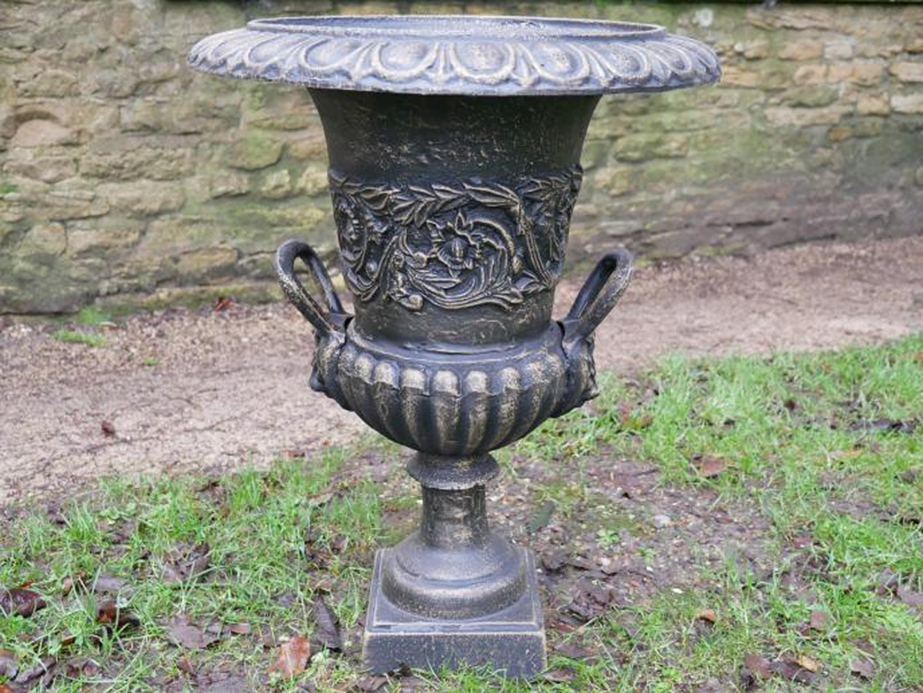 A PAIR OF GOOD QUALITY CAST IRON BRONZED URNS with Lionhead decoration, 63cm high x 48cm wide