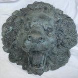 A CIRCULAR BRONZE LION HEAD WATER FEATURE, 46cm tall approx