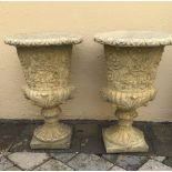 A PAIR OF STONE GARDEN URNS, 61cm high approx