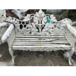 A VERY FINE CAST IRON TWO SEATER GARDEN BENCH with Irish Wolf hound decoration, 64in wide, wooden